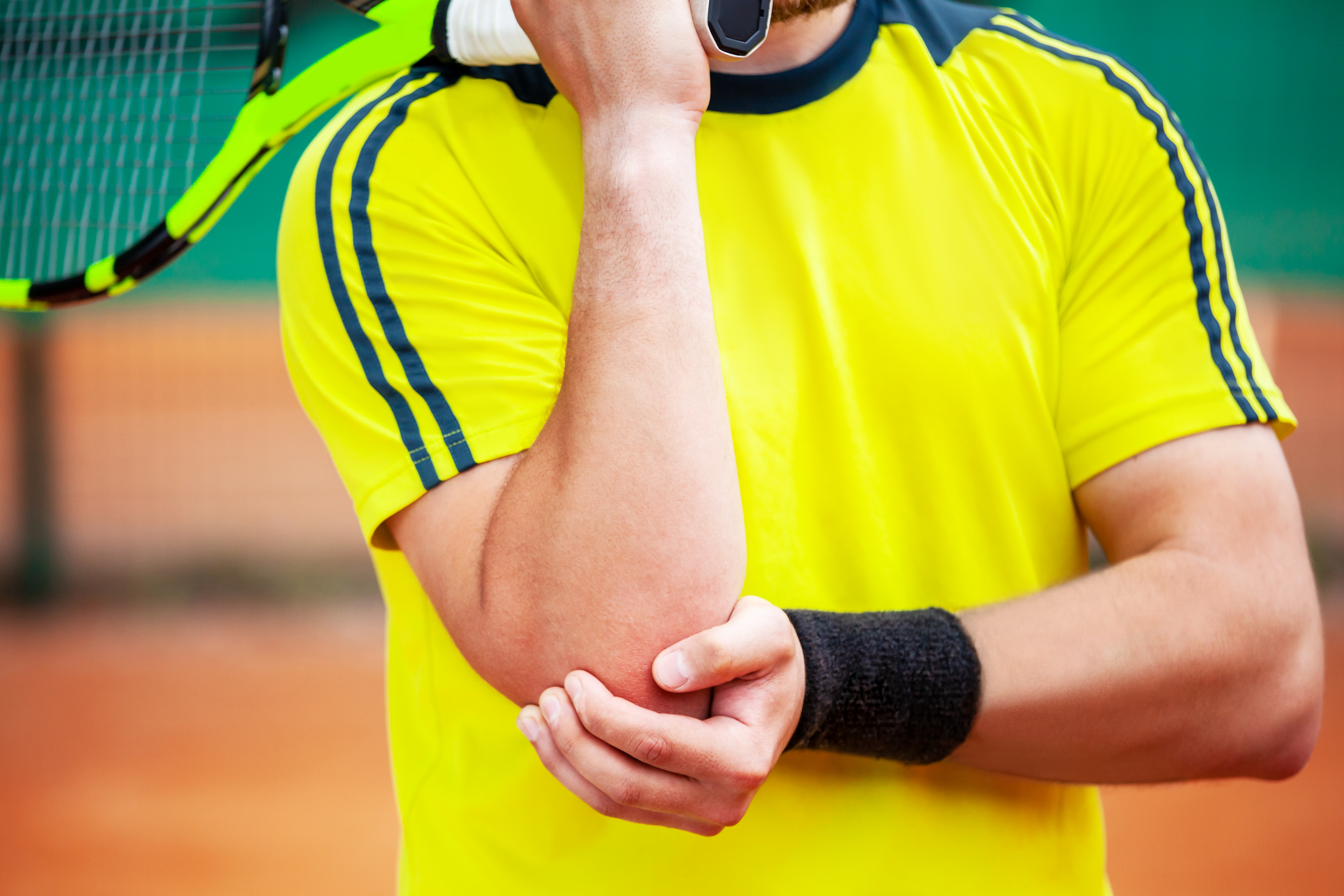 Male athlete with symptoms of tennis elbow.