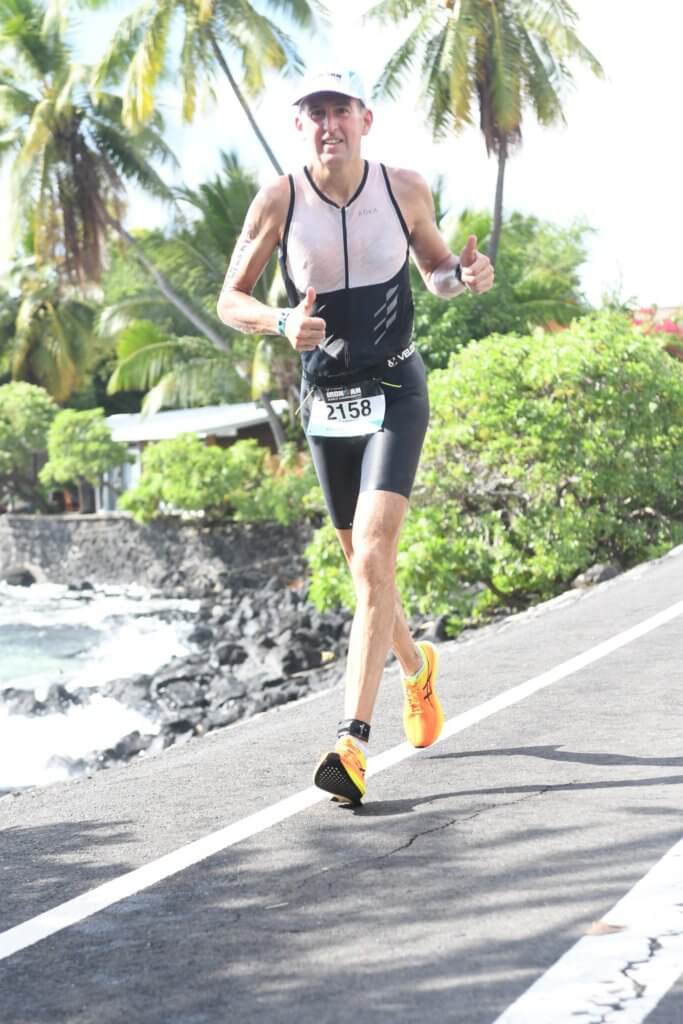 Dr. Garrett Moss running in Hawaii as he competes in the IronMan World Championship