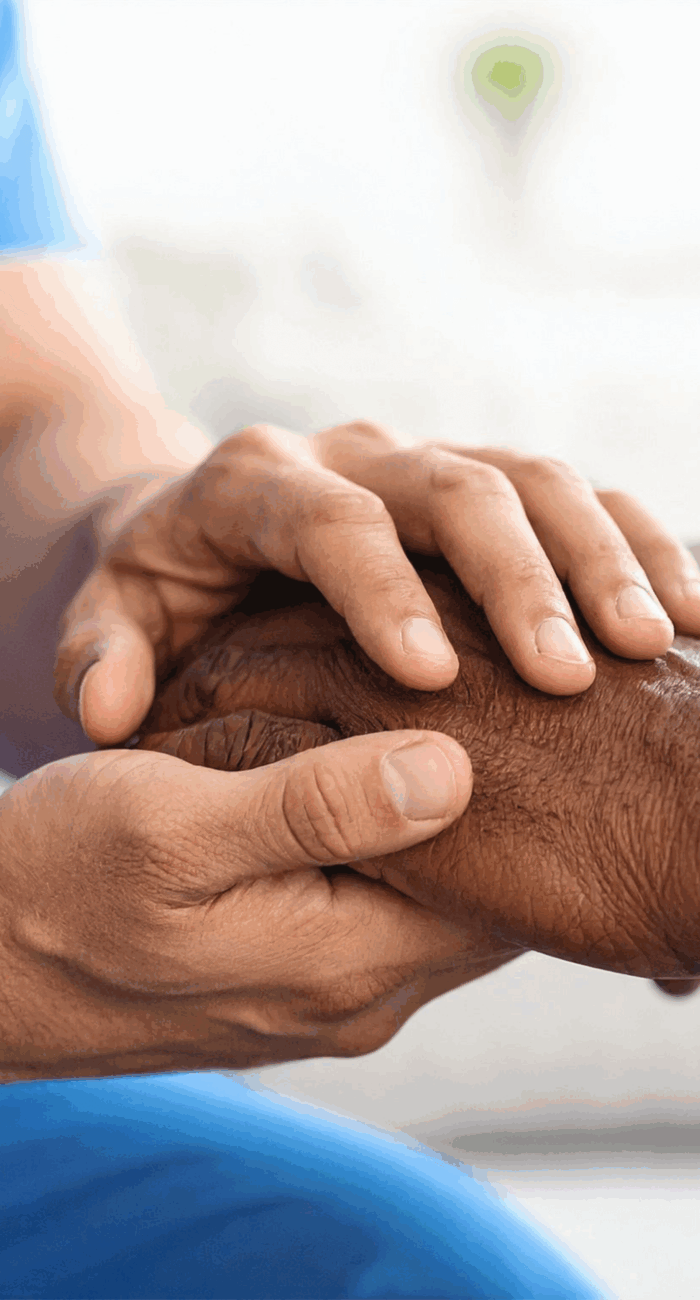 Long Island doctor supporting patient by holding their hands